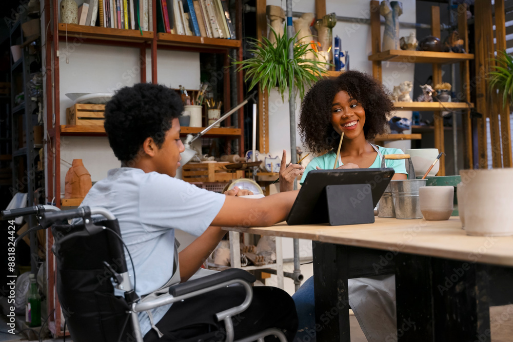 Fototapeta premium Disability man are making earthenware at workshop.