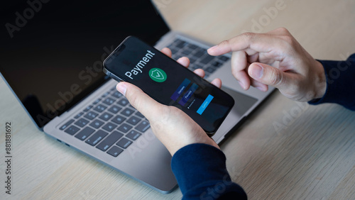 Obraz na płótnie Buy now pay later online shopping concept. Hands holding mobile phone on blurred store as background. Online shopping. Paying after delivery. Complete the payment after purchase at no added cost. w salonie