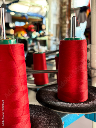 Babies of red thread for a sewing machine in close-up