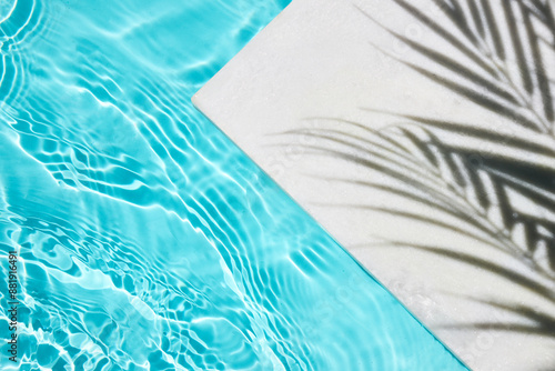Wallpaper Mural Poolside Shadow Shadow of a palm tree on a white surface next to a clear blue swimming pool. Torontodigital.ca