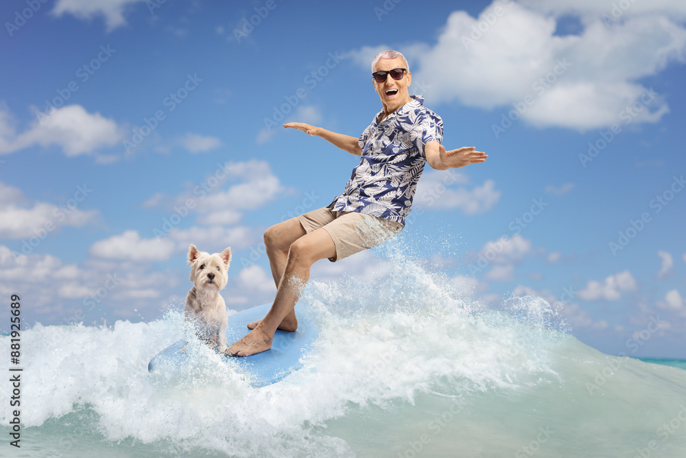 Elderly man riding a surfboard in the sea