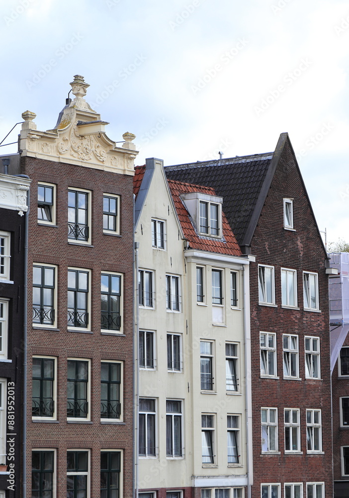 Fototapeta premium Amsterdam Damrak Canal House Facades with Various Gables, Netherlands