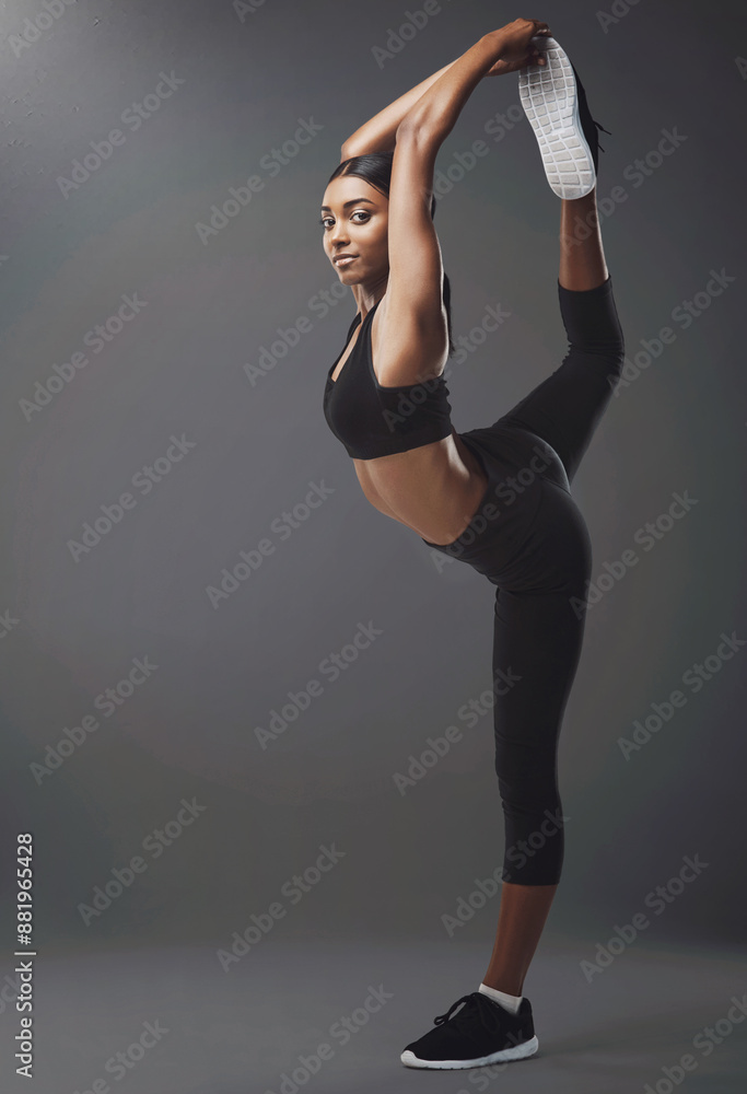 Fitness, legs and woman stretching in studio for exercise with mockup space for body training. Sports, warm up and portrait of Indian female athlete with workout for wellness by gray background. Fitness, legs and woman stretching in studio for exercise with mockup space for body training. Sports, warm up and portrait of Indian female athlete with workout for wellness by gray background.