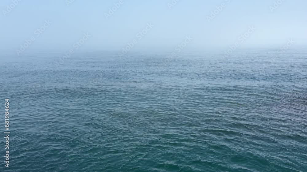 Blue sea waves and sky at misty morning. Blue sea waves and sky at misty morning.