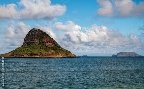 Scenic view of Chinaman's Hat island in Oahu, Hawaii with a clear blue sky and ocean