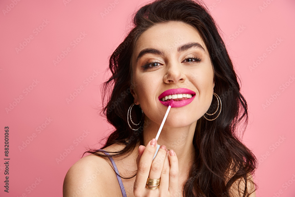Elegant woman holding lipstick, showcasing natural beauty against a vibrant backdrop. Elegant woman holding lipstick, showcasing natural beauty against a vibrant backdrop.