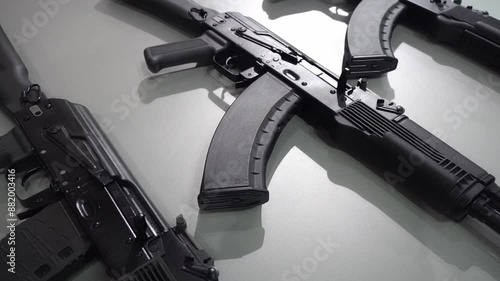 Machine guns and machine guns at a military weapons show. Black modern machine guns for the army and police. Arms trade concept. High quality FullHD footage