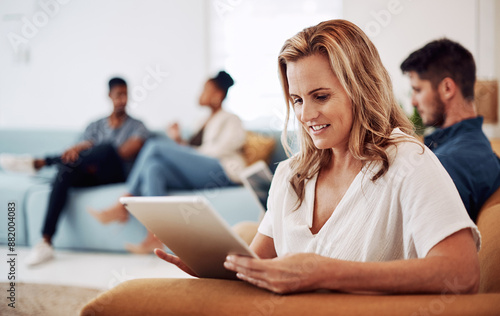 Business, woman and relax in office with tablet on sofa by company for job, career and work as journalist by news agency. Employee, online and couch in workplace for research, professional and editor