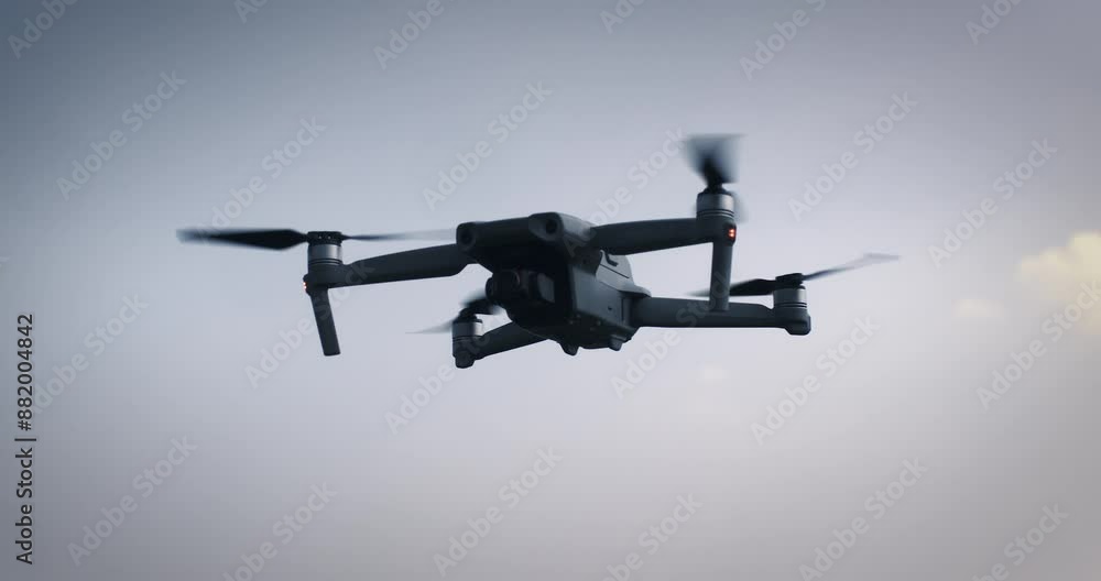 Super slow motion of latest technology high tech drone is flying against blue sky at 1000 fps. Super slow motion of latest technology high tech drone is flying against blue sky at 1000 fps.