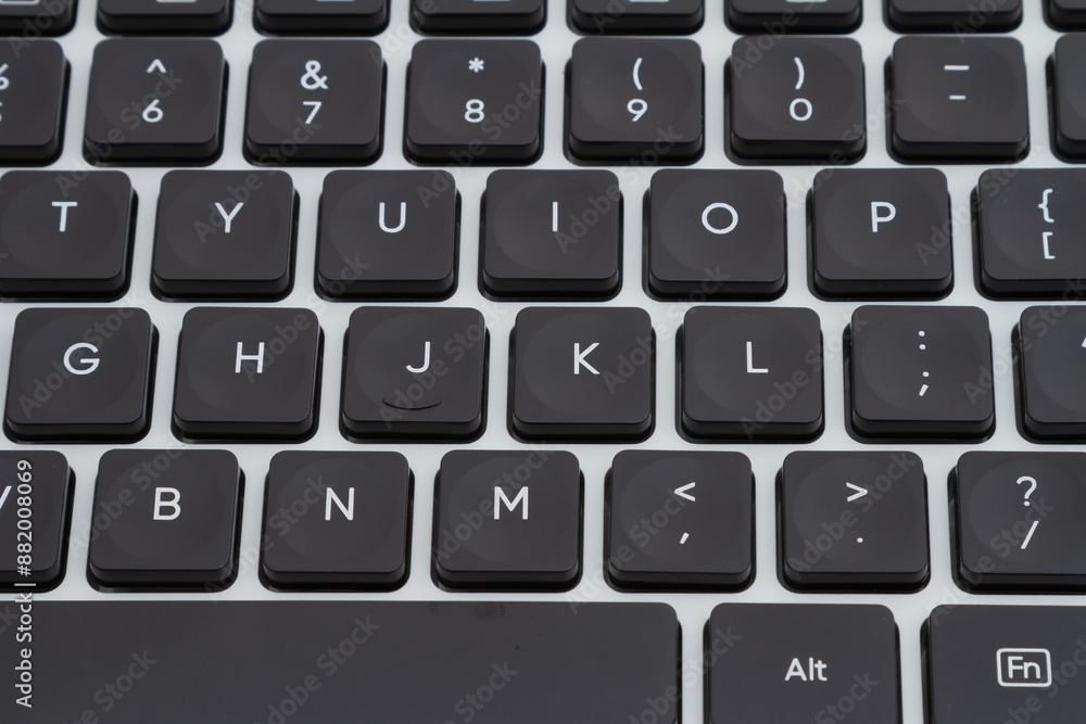 Closeup of a black and silver keyboard background Closeup of a black and silver keyboard background