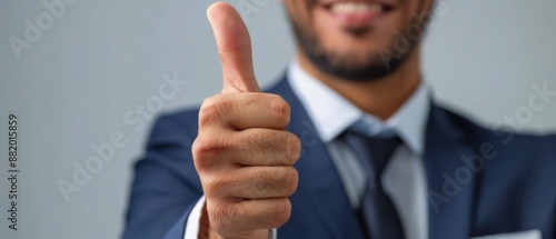 Smiling Man Gives Thumbs Up in Office Setting