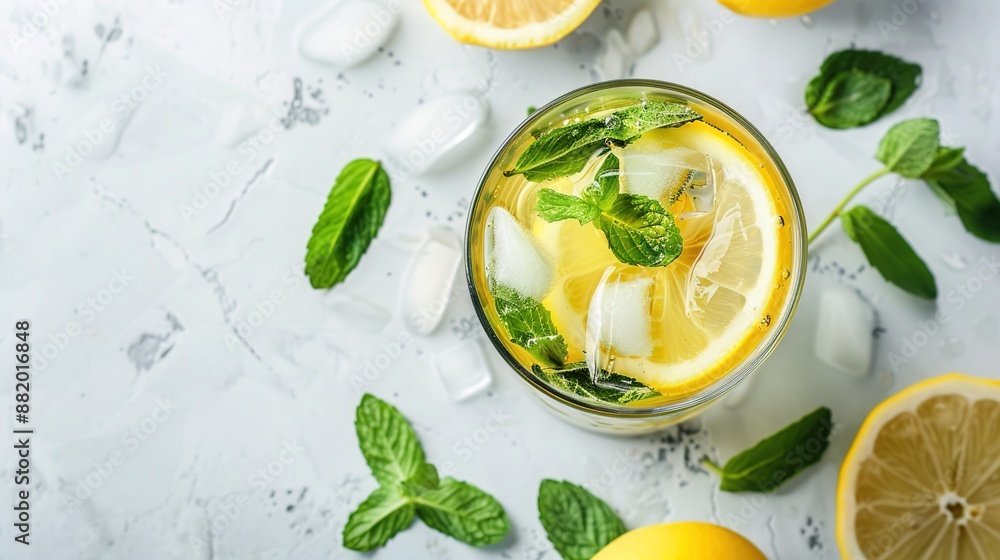 Refreshing Iced Green Tea Infused with Mint and Lemon on Minimalist Background Refreshing Iced Green Tea Infused with Mint and Lemon on Minimalist Background