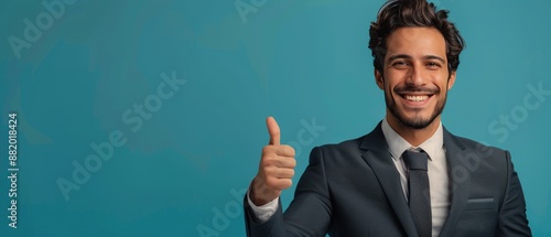 Smiling Businessman Giving Thumbs Up in Front of Blue Background