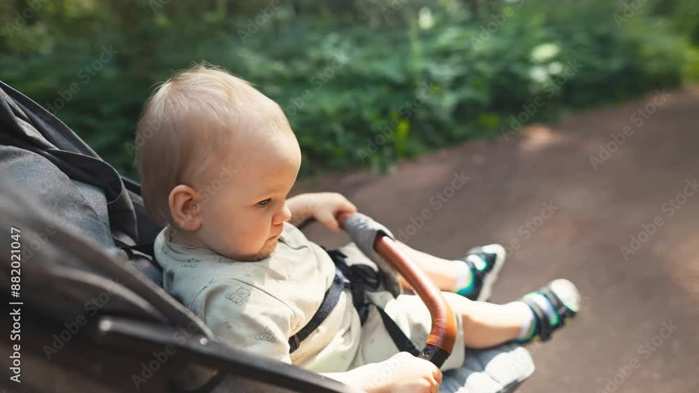A baby in a stroller on a sunny day, enjoying a leisurely stroll, connecting with nature and feeling the gentle breeze A baby in a stroller on a sunny day, enjoying a leisurely stroll, connecting with nature and feeling the gentle breeze