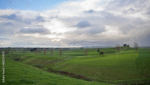 Low angle and autumnal view of grassland and ranch on the hill at New Zealand 