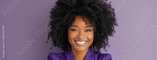 Smiling Woman With Curly Hair Against Purple Background