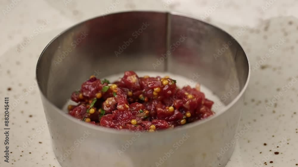 Meat tartare is being prepared. Meat tartare is being prepared.