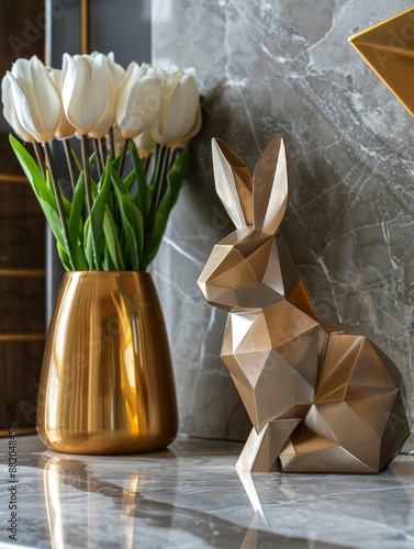 Golden Geometric Rabbit Figurine on Marble Tabletop With White Tulip Bouquet