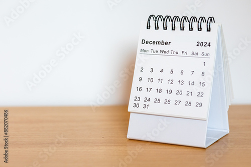 2024 calendar - December month page on the wooden desk