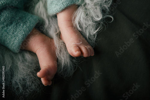 Newborn baby feet on the background