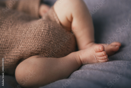Newborn baby feet on the background
