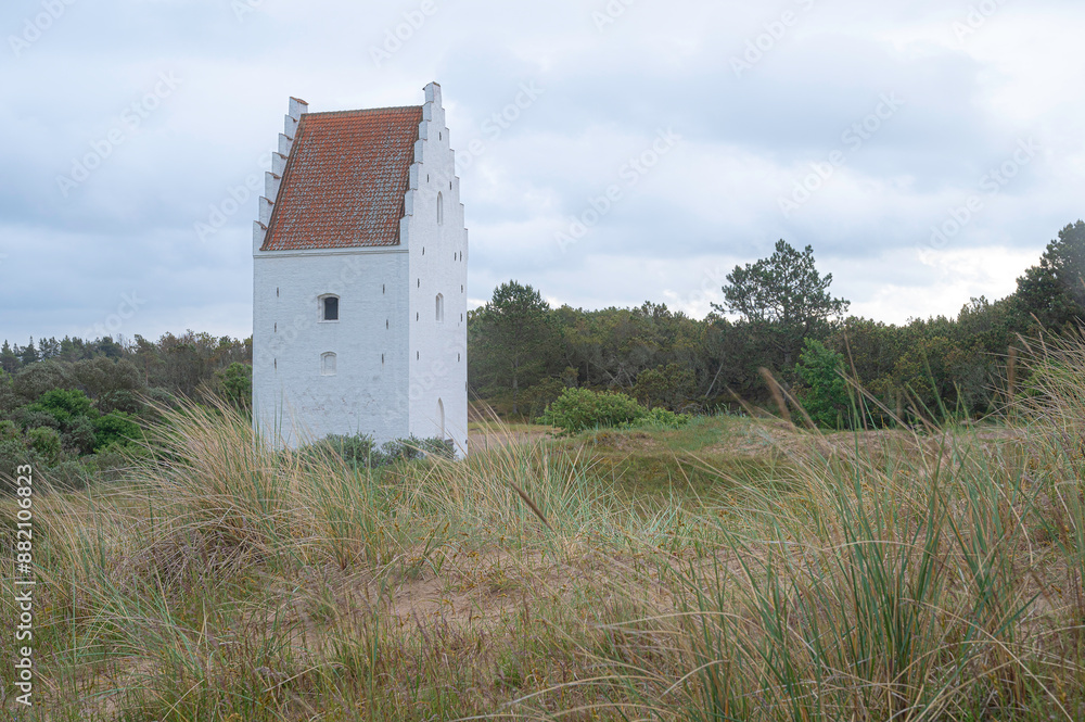 The Tower of the Sand buried Church from the 14th century in the sanddunes full of ryegrass, Skagen, Denmark, May 30, 2024 The Tower of the Sand buried Church from the 14th century in the sanddunes full of ryegrass, Skagen, Denmark, May 30, 2024