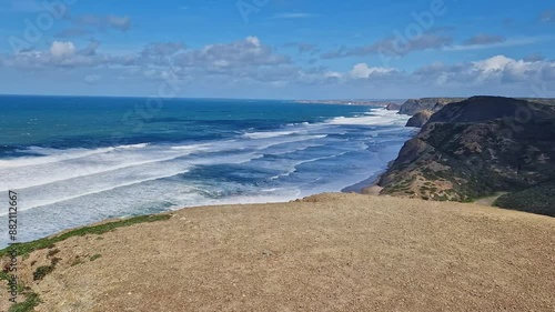 View of idyllic nature landscape rocky cliff shore waves crashing on Praia da Cordoama beach atlantic ocean Vila do Bispo, Sagres, Algarve, Portugal Europe