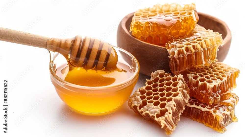 Wooden spoon dripping with honey, a piece of honeycomb Wooden spoon dripping with honey, a piece of honeycomb