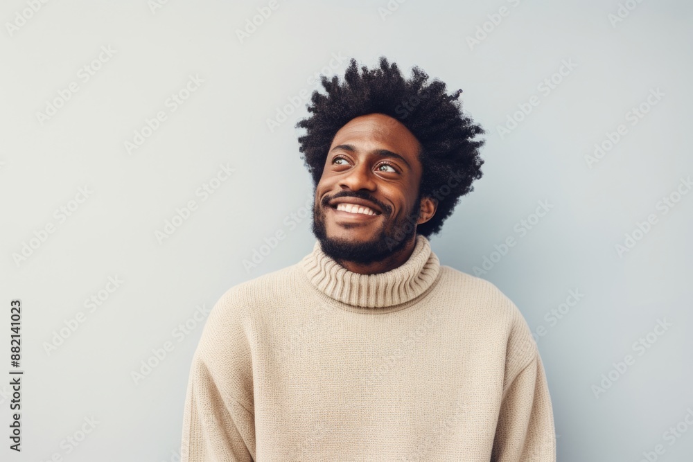Portrait of a glad afro-american man in his 30s wearing a cozy sweater isolated in plain white digital canvas Portrait of a glad afro-american man in his 30s wearing a cozy sweater isolated in plain white digital canvas
