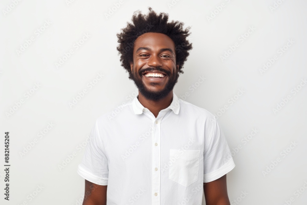 Portrait of a happy afro-american man in his 20s donning a trendy cropped top in front of plain white digital canvas Portrait of a happy afro-american man in his 20s donning a trendy cropped top in front of plain white digital canvas