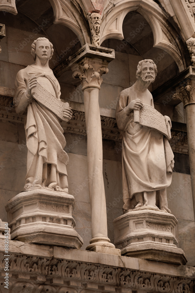 Fototapeta premium Funny statue of saints in a church