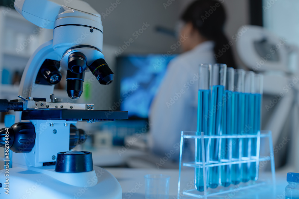 scientist is using microscope in laboratory, chemical researcher works in chemistry with concentration, chemist is conducting a science experiment using a microscope to test experimental substances scientist is using microscope in laboratory, chemical researcher works in chemistry with concentration, chemist is conducting a science experiment using a microscope to test experimental substances