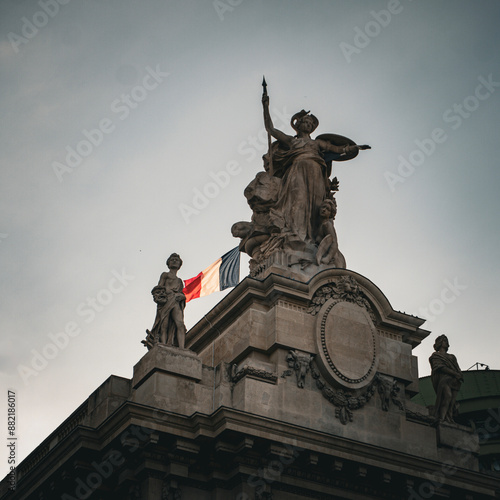 Architectural Details of the Grand Palais with the French Flag - Grandeur and patriotism in a single image.