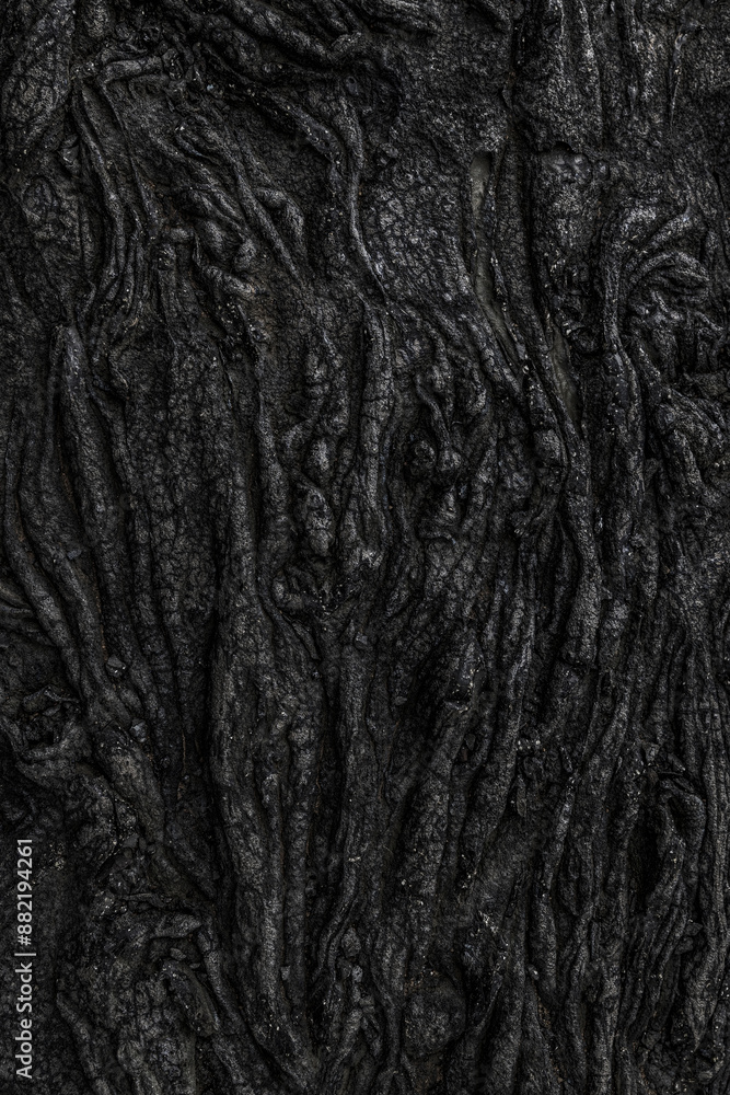 Black volcanic rock forming abstract natural pattern Black volcanic rock forming abstract natural pattern