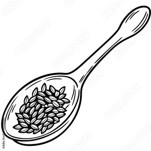 On a spoon, black caraway seeds