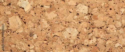 Soft and cracked brown cork background with a rough texture. photo