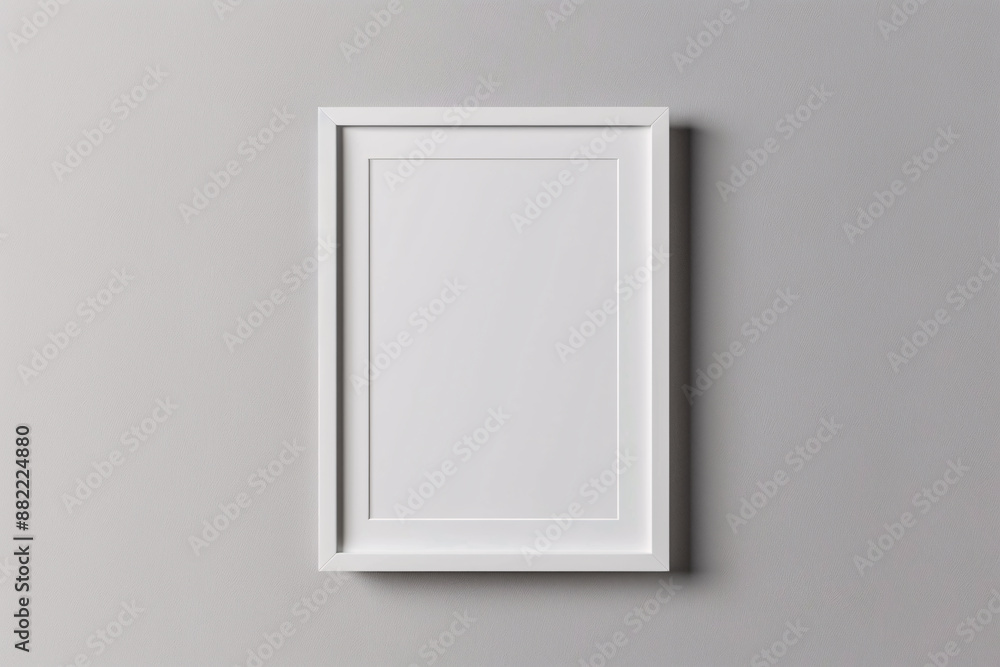 A photo mockup featuring a blank white frame centered on a plain, light gray background. The frame ratio is perfectly balanced, with sharp edges and clean lines, providing an ideal template for A photo mockup featuring a blank white frame centered on a plain, light gray background. The frame ratio is perfectly balanced, with sharp edges and clean lines, providing an ideal template for