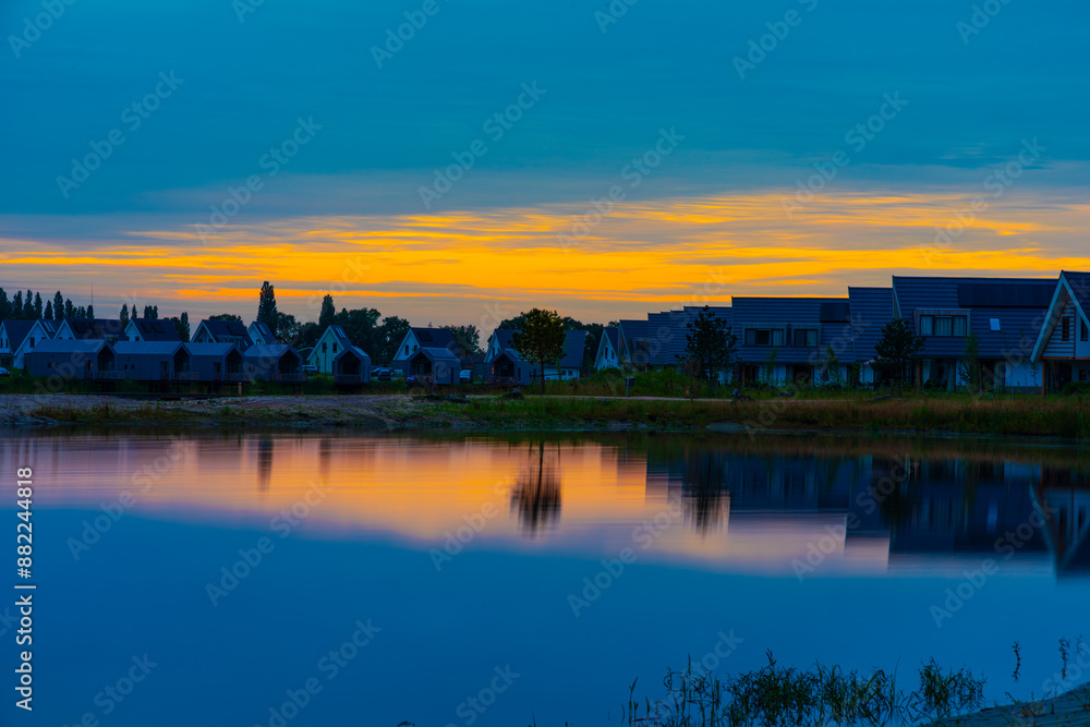 Houses along the lake with mirror image Houses along the lake with mirror image