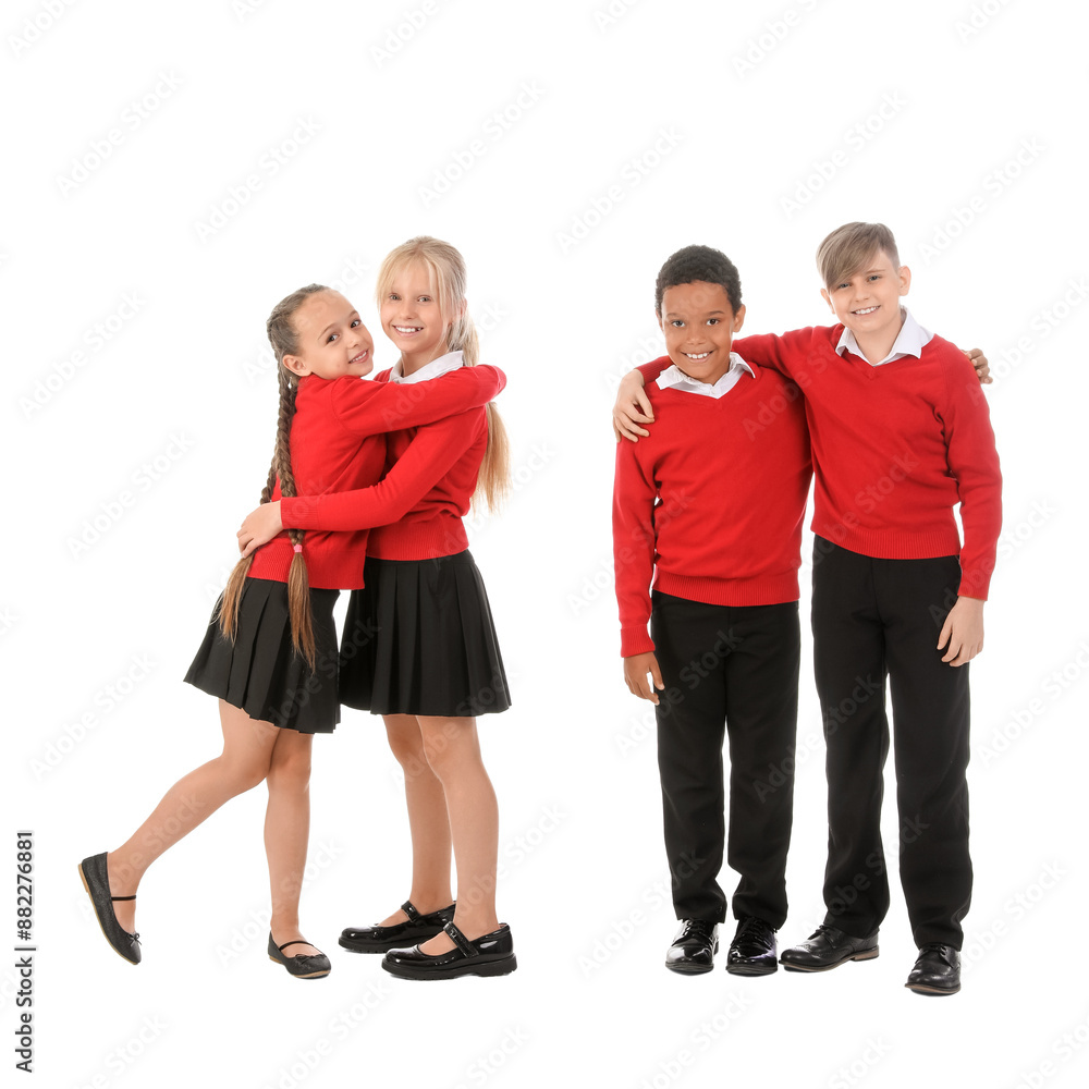Little classmates in stylish uniform isolated on white background