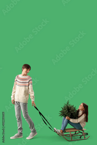 Cute children with sleigh a...