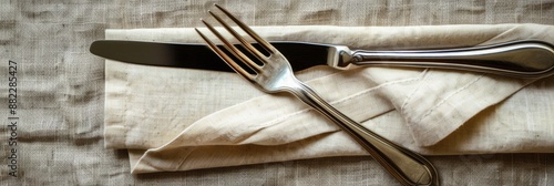 Napkin Folded. Kitchen Utensile Set with Knife and Fork in Cotton Napkin