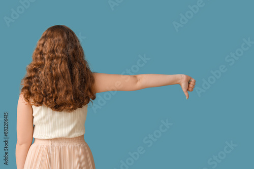 Young woman showing dislike...