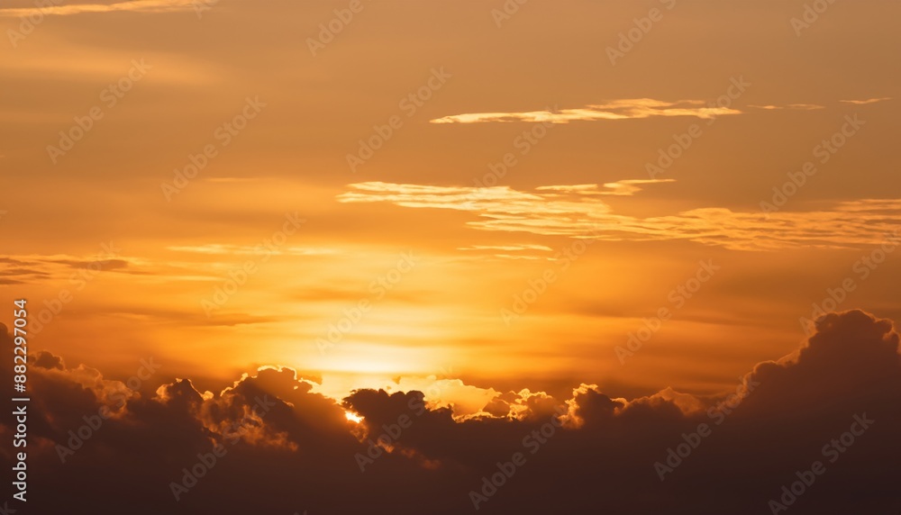 Golden sunset with dramatic clouds, casting a warm glow across the sky. Golden sunset with dramatic clouds, casting a warm glow across the sky.