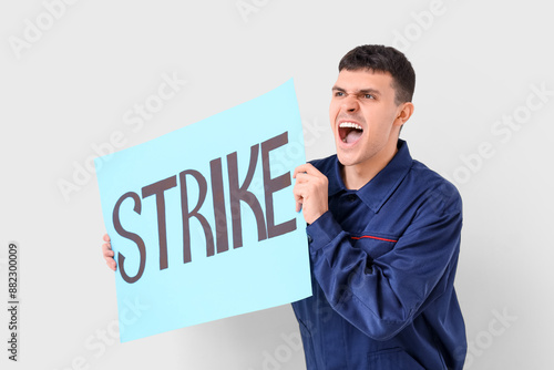 Protesting mechanic holding...