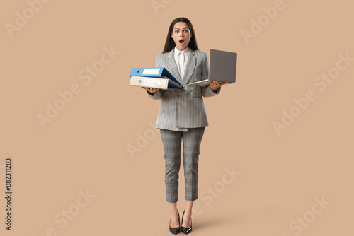 Shocked businesswoman with ...