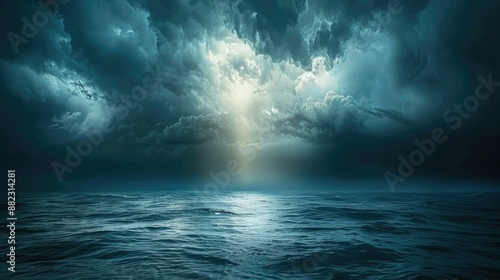 Sunlight breaking through storm clouds at sea © yendi