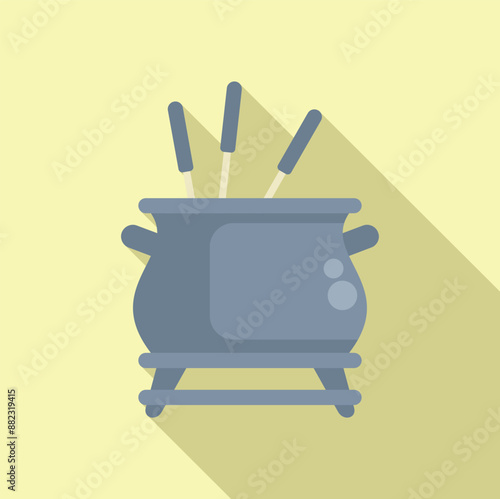 Grey fondue pot standing on a stove with long forks for dipping food, winter family dinner concept