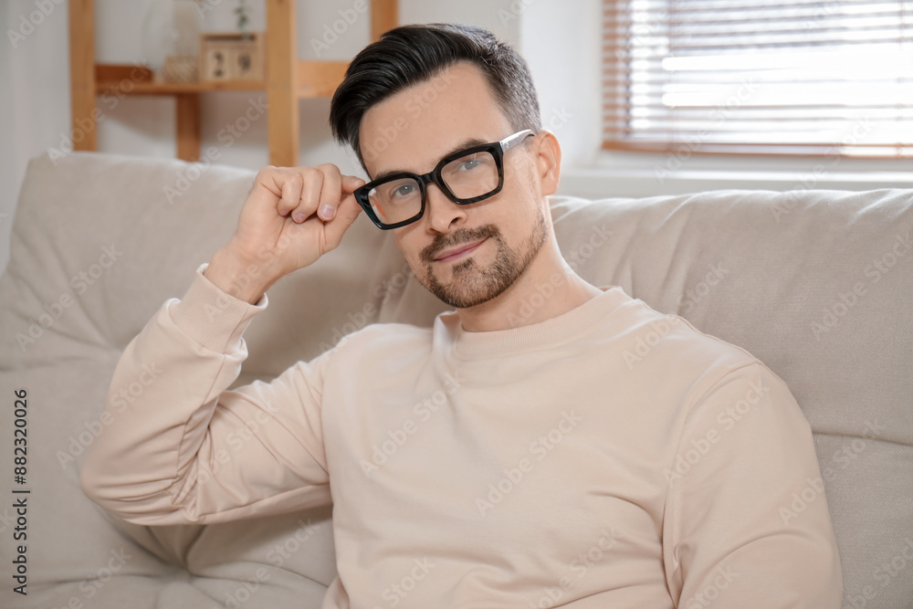 Handsome young man in eyeglasses at home Handsome young man in eyeglasses at home