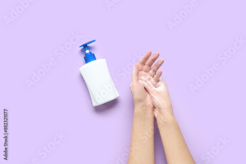 Woman with bottle of saniti...