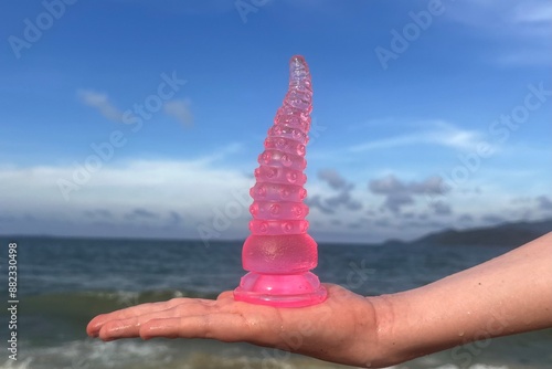 adult sex toy, pink octopus tentacles, toy from Japan, sea backround